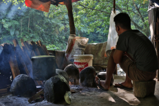Some of the jungle-portieres (helpers of the guides) were already cooking coffee, tea and dinner, while we were having a swim in the small river. Bukit Lawang jungle trek thefreesurfer.com dinner